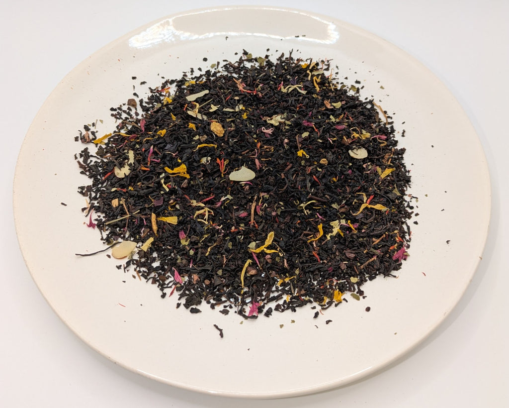 A scoop of Douglas Cherry Nut tea on a white plate