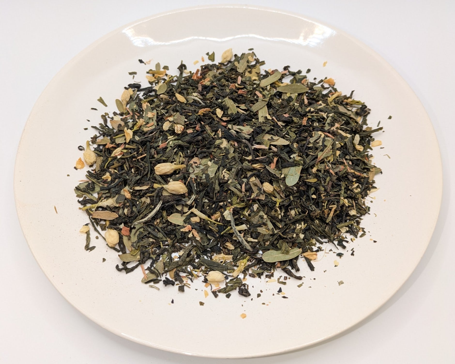 A scoop of Imperial Consort Lychee tea on a white plate
