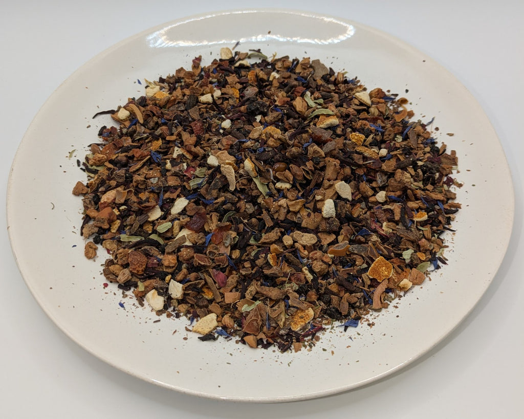 A scoop of J. Chapman Appleseed tea on a white plate