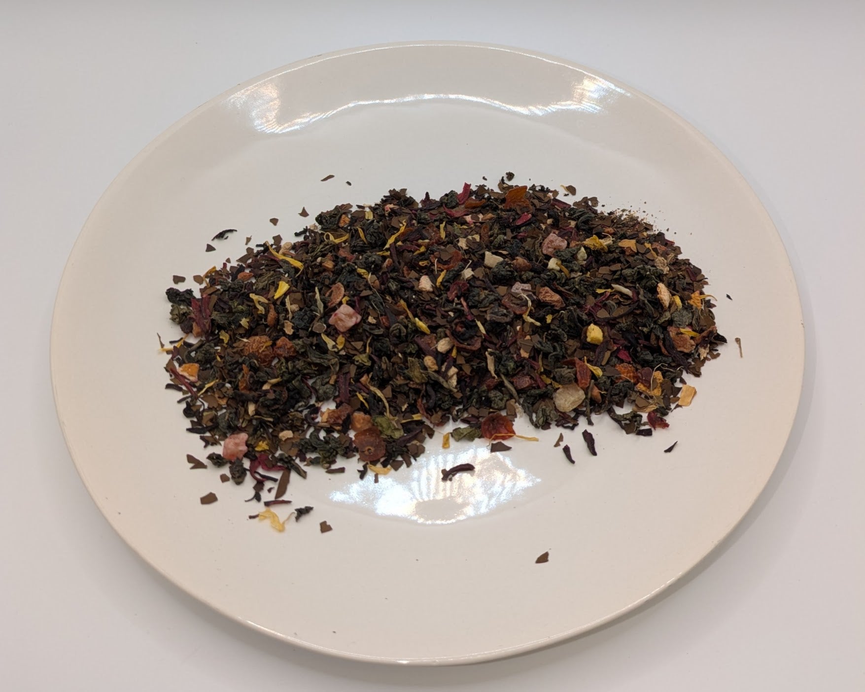 A scoop of majarani chai mate tea on a white plate