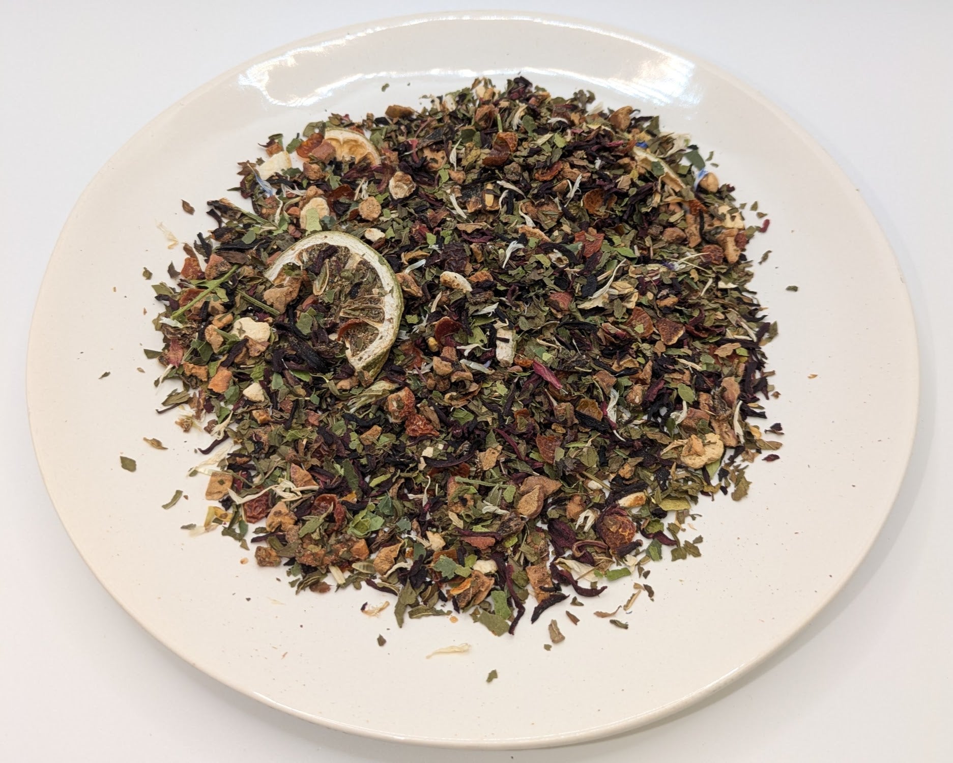 A scoop of Phoebe's Flower Garden tea on a white plate