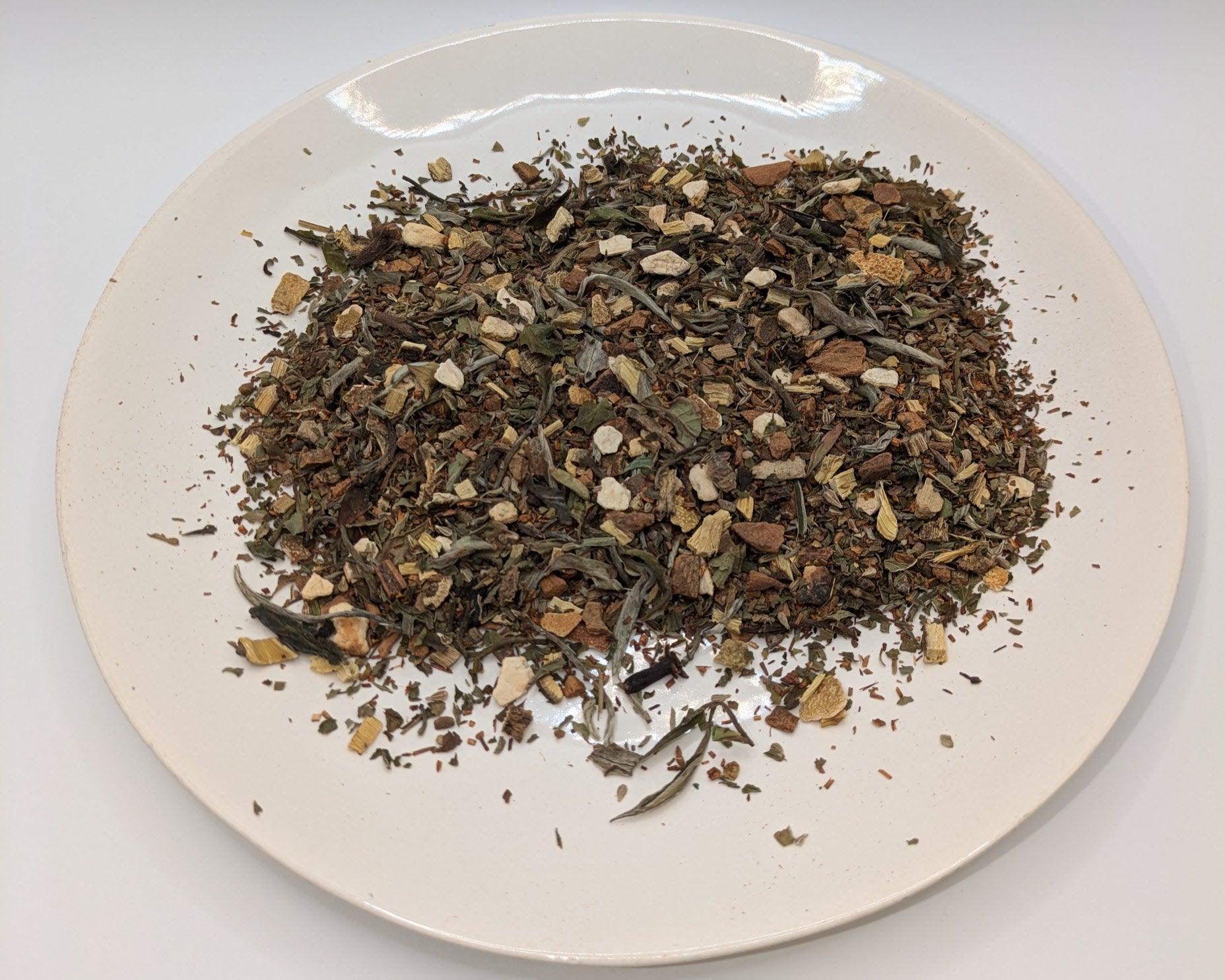 A scoop of Pontefract Spice tea on a white plate