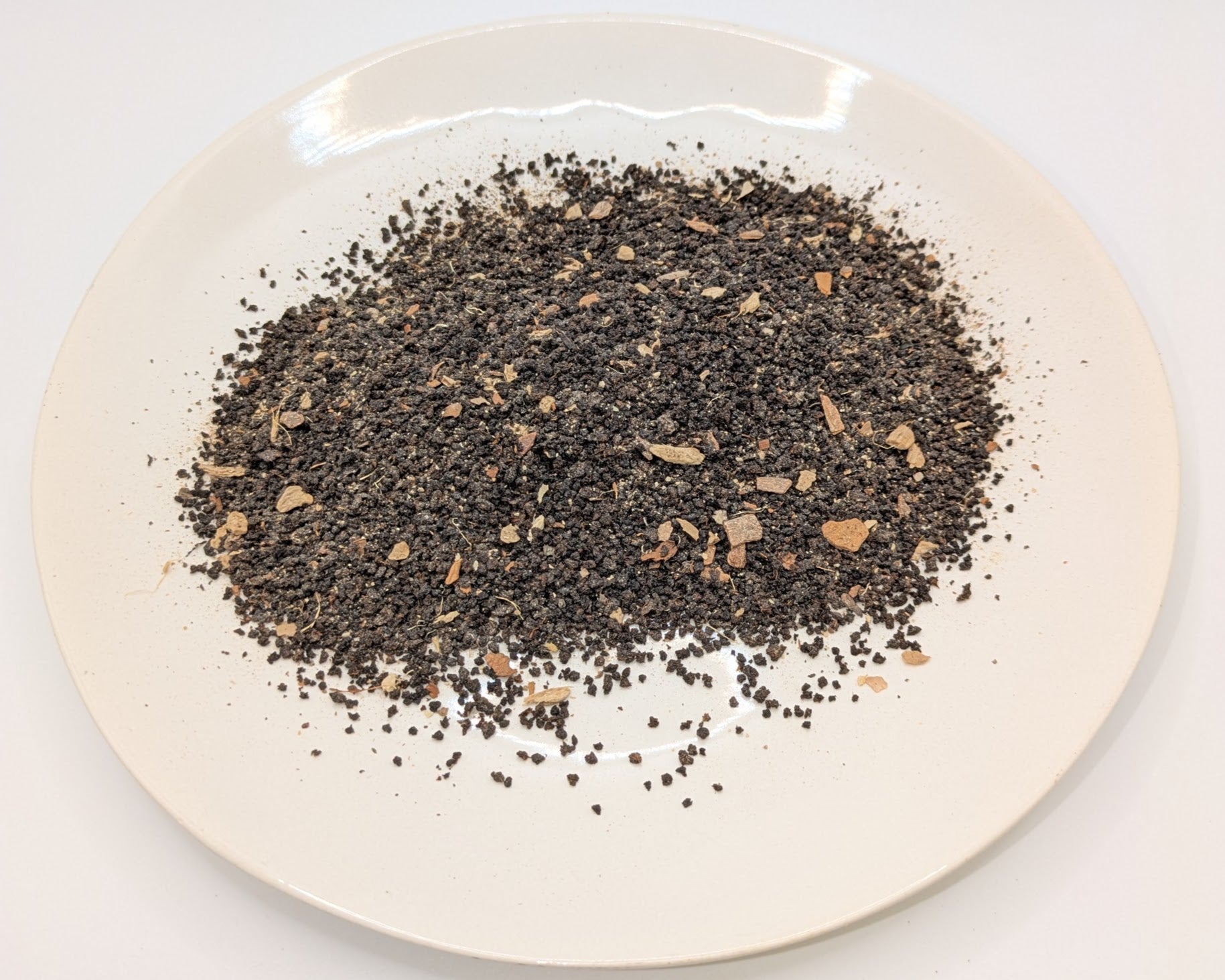 A scoop of Tiffey's Spiced Chai tea on a white plate